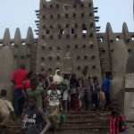 The great mosque in Djenne -- the largest mud building in the world gets a new coat of mud this month. It takes the whole city to get it done!